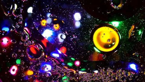 Sparkling abstract background. Psychedelic swirls, oil bubbles. Rainbow gradient Stock Footage 152779258