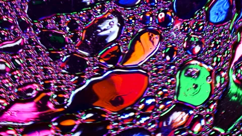 Sparkling abstract background. Psychedelic swirls, oil bubbles. Rainbow gradient Stock Footage 152834071