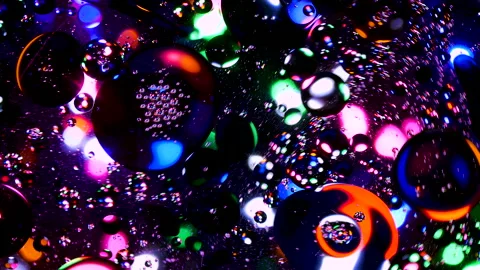 Sparkling abstract background. Psychedelic swirls, oil bubbles. Rainbow gradient Stock Footage 152836052