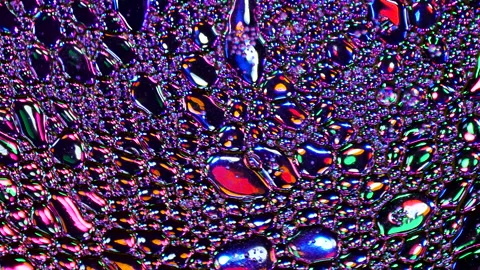 Sparkling abstract background. Psychedelic swirls, oil bubbles. Rainbow gradient Stock Footage 152849282