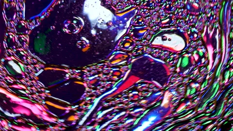 Sparkling abstract background. Psychedelic swirls, oil bubbles. Rainbow gradient Stock Footage 152883189
