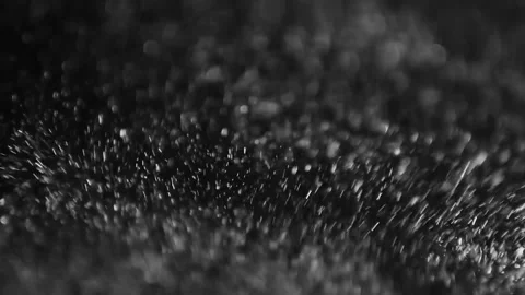 Sparkling black abstract particles in motion. Dark dynamic bokeh light dots floa Stock-Footage 340450116