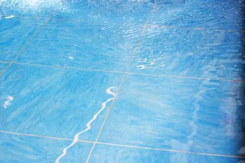 Sparkling Blue Pool Tile Surface with Water Reflection Stock Photos