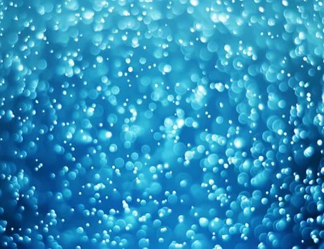 Sparkling bokeh light effect with dark blue background Stock Photos