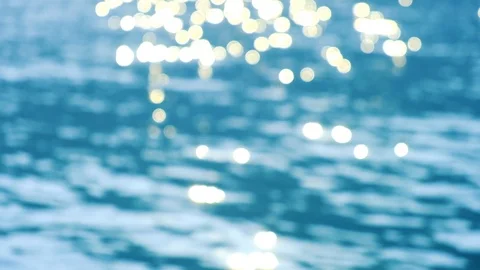 Sparkling bright wavy water shining at sunny summer day in slow motion. Abstr Stock Footage