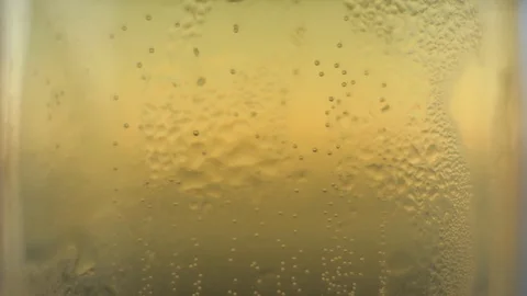 Sparkling bubbles in a mug of cold beer Stock Footage 115576270