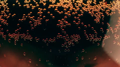 Sparkling bubbles on a red background. 4K resolution high-quality video presents Stock Footage 132013634