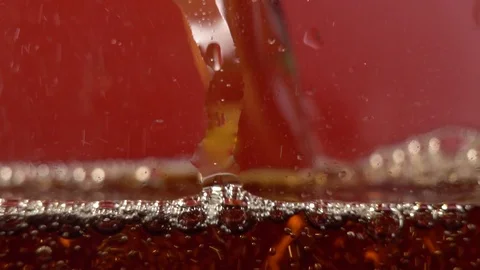 Sparkling bubbles on a red background, seamless loop of bubbles rising inside a Stock Footage 122993798
