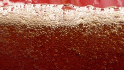 Sparkling bubbles on a red background, seamless loop of bubbles rising inside a Stock Footage 122993879