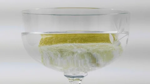 Sparkling bubbles water with a slice of lime, 4k Stock Footage 91354677