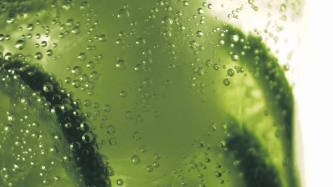 Sparkling bubbles water with a slice of lime Stock Footage 111495245