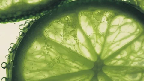 Sparkling bubbles water with a slices of lime Stock Footage 111539556