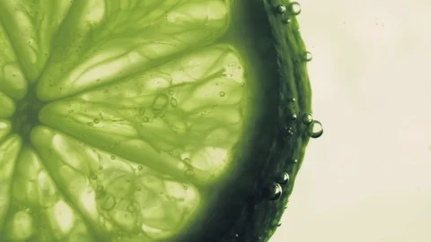 Sparkling bubbles water with a slices of lime Stock Footage 111539854