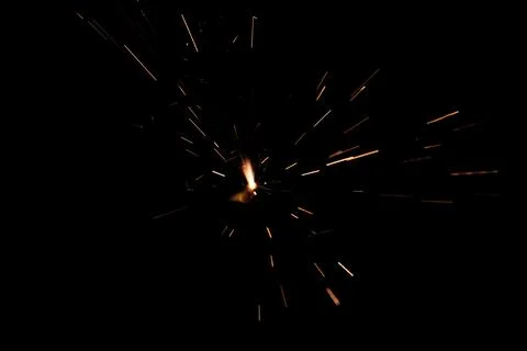 Sparkling burning sparkler on a black background. Stock Photos