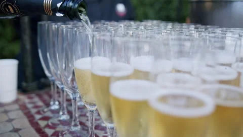 Sparkling champagne glasses filled with bubbles at a celebratory event Stock Footage 321396778