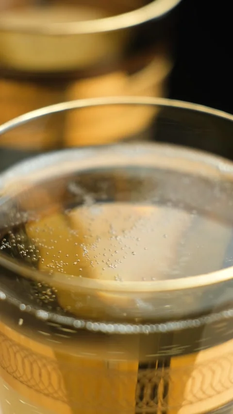 Sparkling Champagne Sparkling Wine Bubbles in Glass, Vertical Macro View Stock Footage 329552316