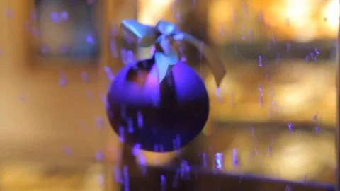 Sparkling Christmas ball against the backdrop of rising air bubbles in the water Stock Footage 69920822