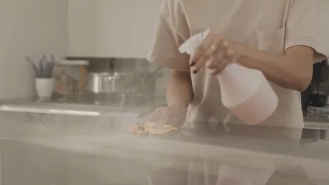 Sparkling Clean: Wiping and Sanitizing Kitchen Surface Stock Footage 320503898