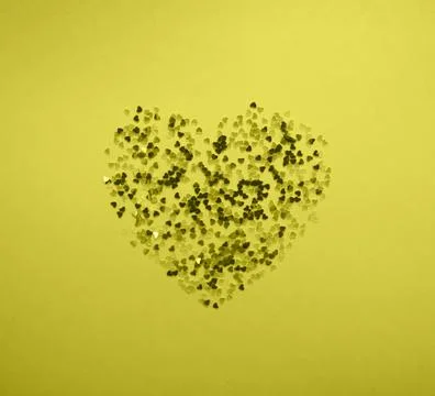 Sparkling confetti in shape of heart on blue background Stock Illustration