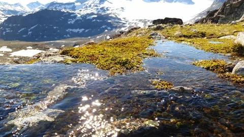 Sparkling creek infront of mountain range Norway Stock Footage 156795015