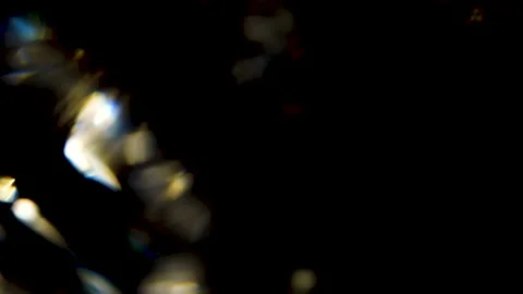 Sparkling Crystal Prism Light Leak Glow Movement with Black Background Stock Footage 239536157