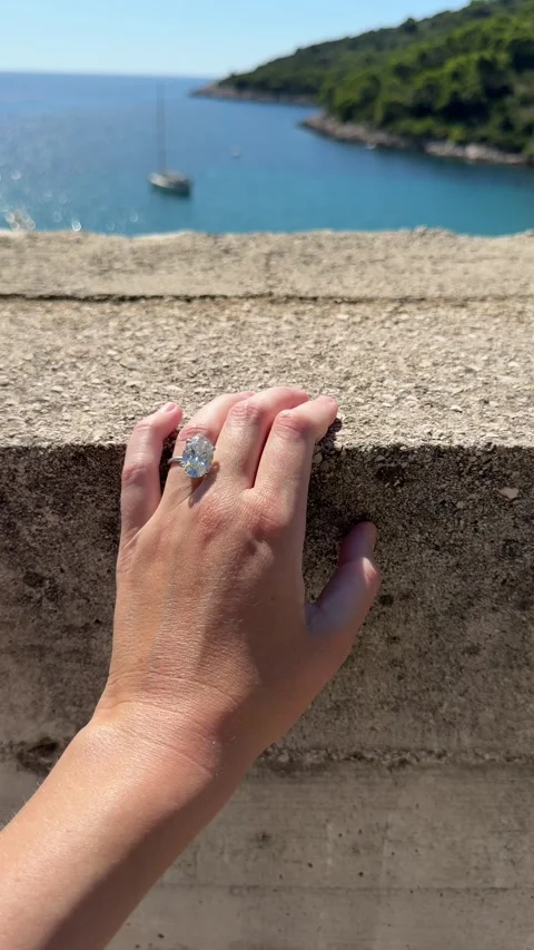 Sparkling diamond ring with Mediterranean view and coastal breeze Stock Footage 318335037
