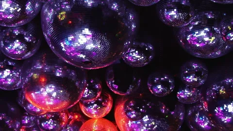 Sparkling Disco Spheres Casting a Radiant Glow on a Lively Evening Stock Footage 334925921