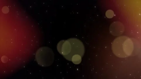Sparkling Dust Particles and Bokeh Lights Floating in Dark Space with Warm Gl Stock Footage 337230122