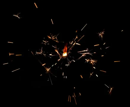 Sparkling fire stick with particles Stock Photos