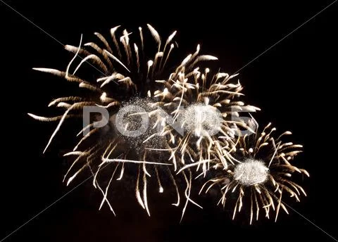 Sparkling fireworks bursts Stock Photos