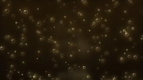 Sparkling gold bubbles floating on a dark luxury background Stock Footage 335874576