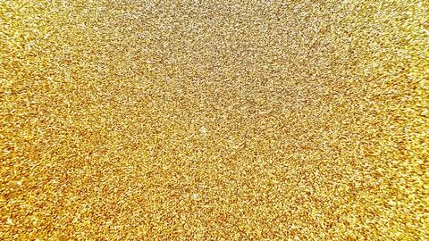 Sparkling gold glitter texture creates a radiant festive background for luxur Stock Photos