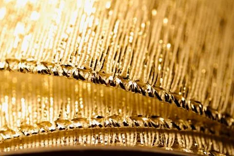 Sparkling gold holiday ribbon macro abstract background Stock Photos