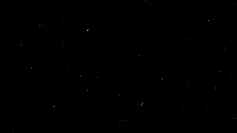 Sparkling golden light particles emitting from a central point against dark Stock Footage 345138184