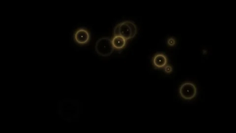 Sparkling golden orbs float in darkness with glowing Видео 338288225