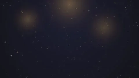 Sparkling golden particles drift on dark blue background with glowing light.. Video stock 341285792