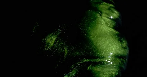 Sparkling green cloud as it moves towards the bottom of the screen. Stock-Footage 217363266