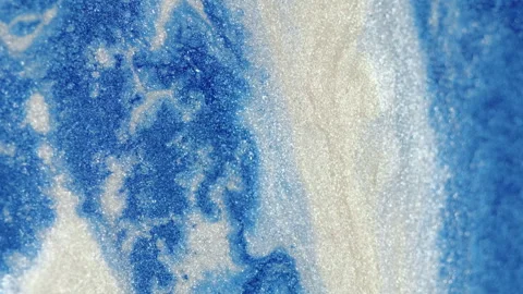 Sparkling ink glitter fluid texture blue white Video stock 253896382