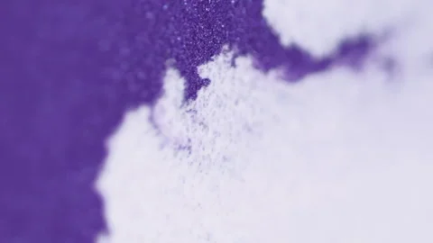 Sparkling ink splatter wet particles white purple Stock Footage 296116557