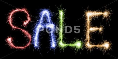 Sparkling inscription of sale on a black Stock Photos
