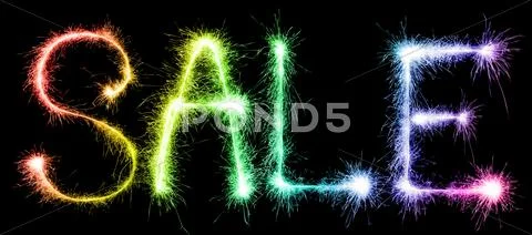 Sparkling inscription of SALE on a black Stock Photos