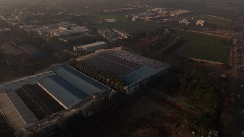 Sparkling light across an extensive array of solar panels mounted on a large Stock Footage 334503978