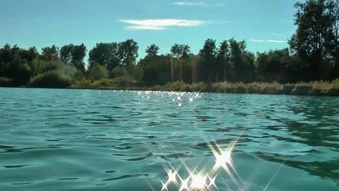 A sparkling light in the lake. Reflection. Video stock 94625470