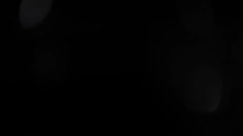 Sparkling lights overlay filter. Crystal reflection. Lens flares motion on black Stock Footage 143470179