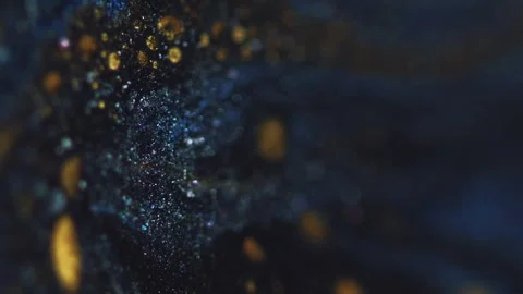 Sparkling liquid glitter paint wave blue gold ink Stock Footage 278847581