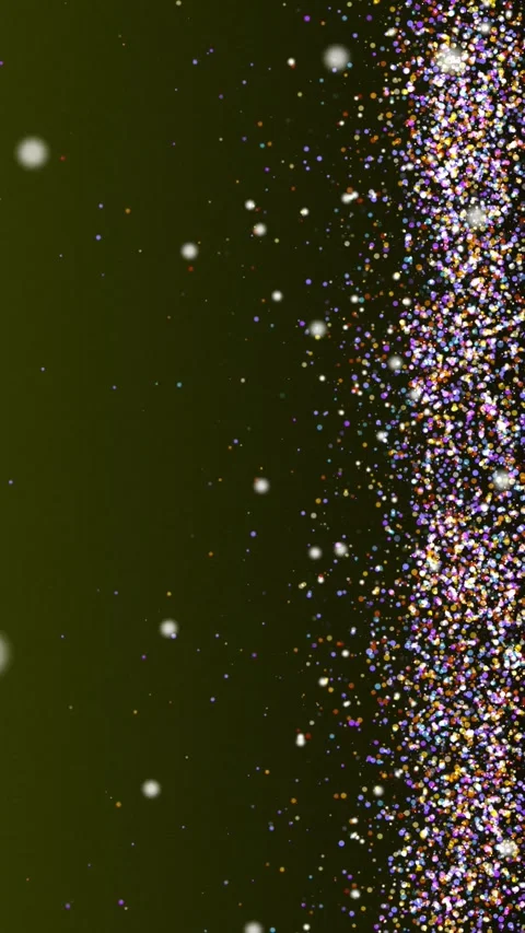 Sparkling magic glitter particles falling on green background Stock Footage 345653573