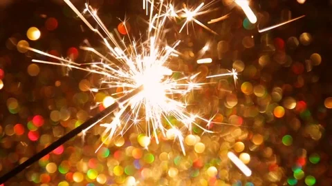 Sparkling New Year's fire on the background of the bokeh Stock Footage 83220737