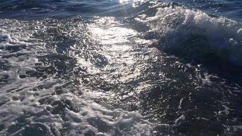 Sparkling ocean waves crashing with white foam and bright sunlight. Stock Footage 337408715