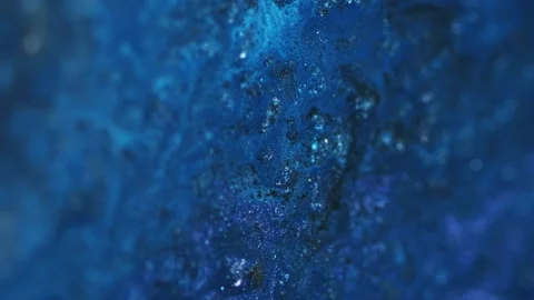 Sparkling paint glitter ink spill blue fluid flow Stock Footage 286288714