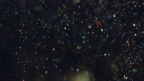 The sparkling particles floating on the dark background. slow motion Stock Footage 160062914